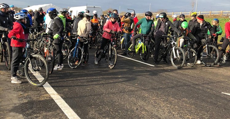 Cyclists prepare to cross the bypass