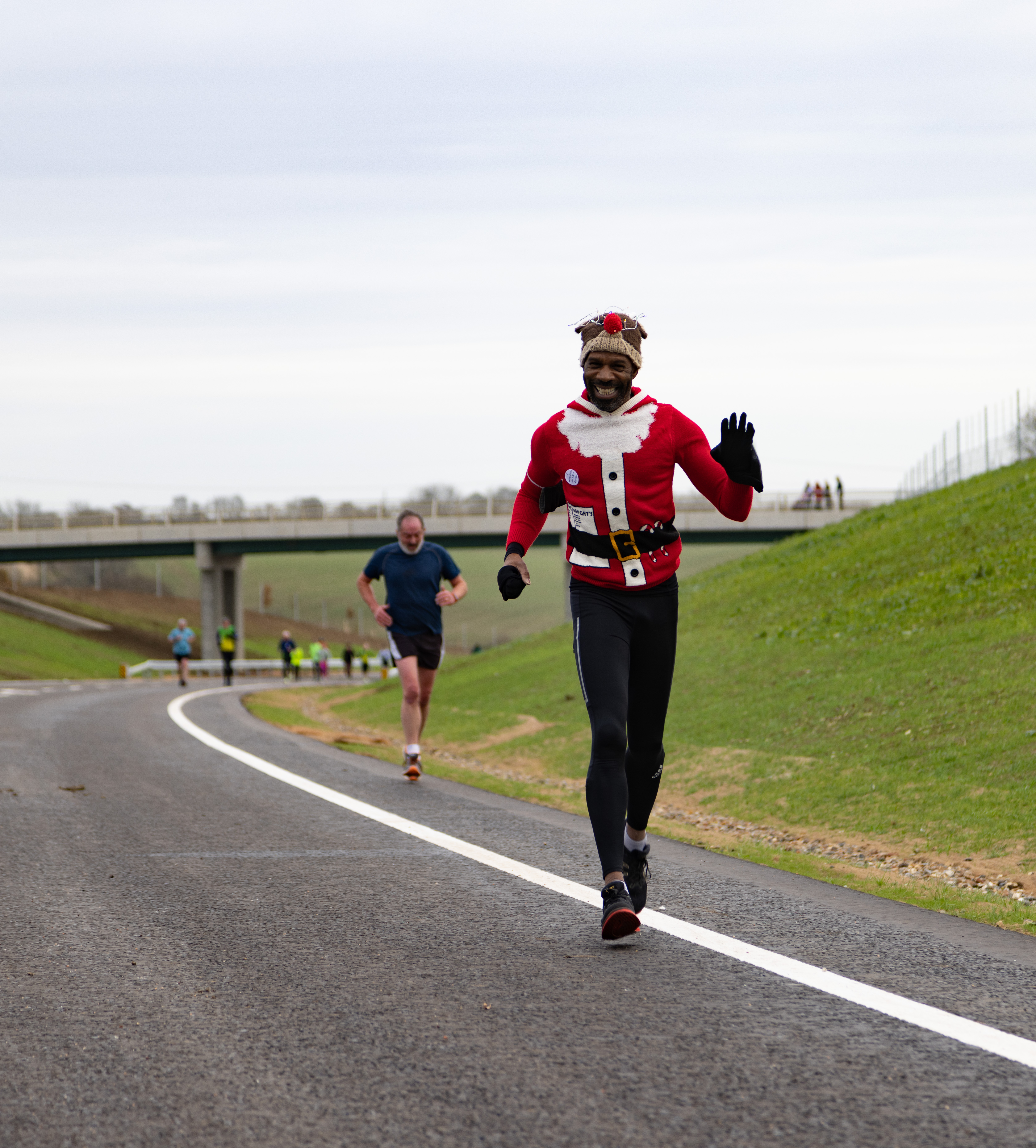 A Santa jogs across the bypass at its opening ceremony