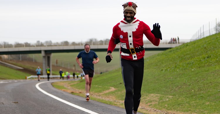A Santa jogs across the bypass at its opening ceremony