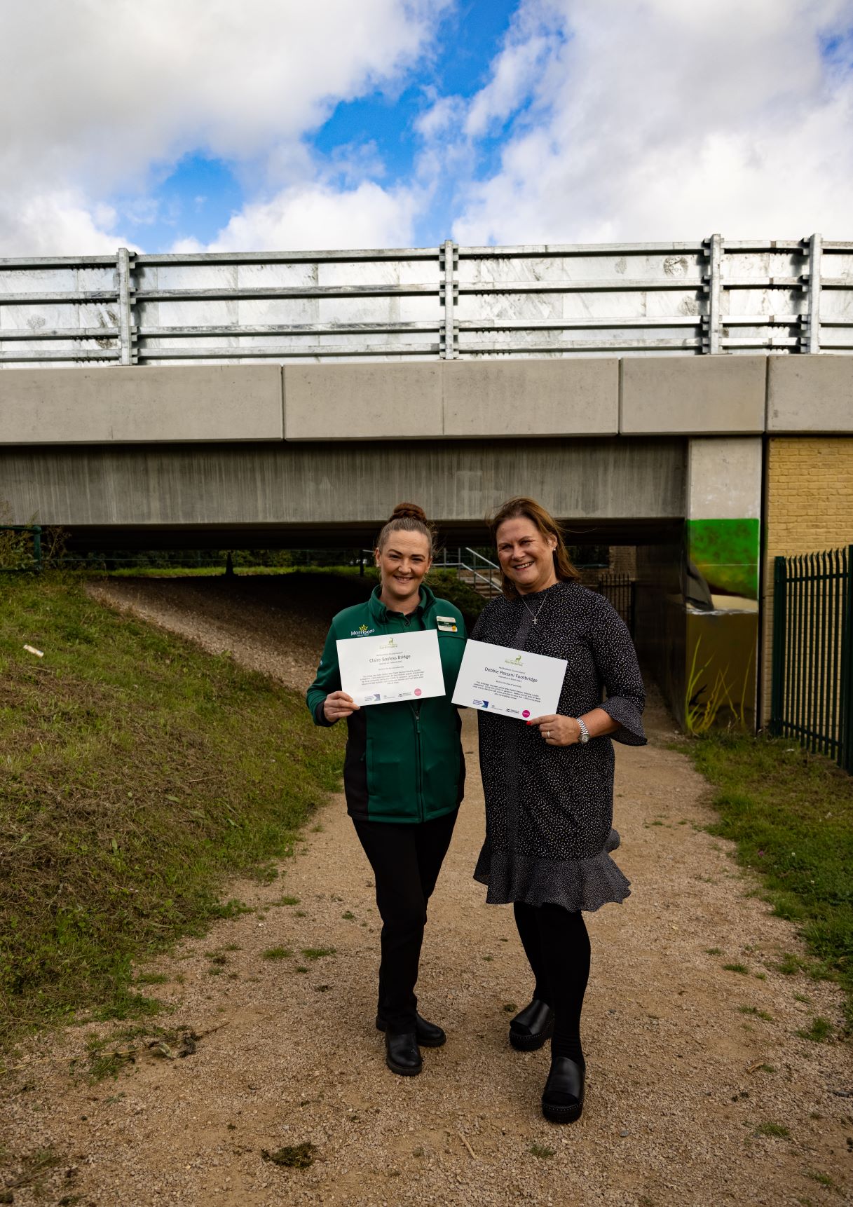 Claire Bayless and Debbie Pezzani at the bridge named in their honour