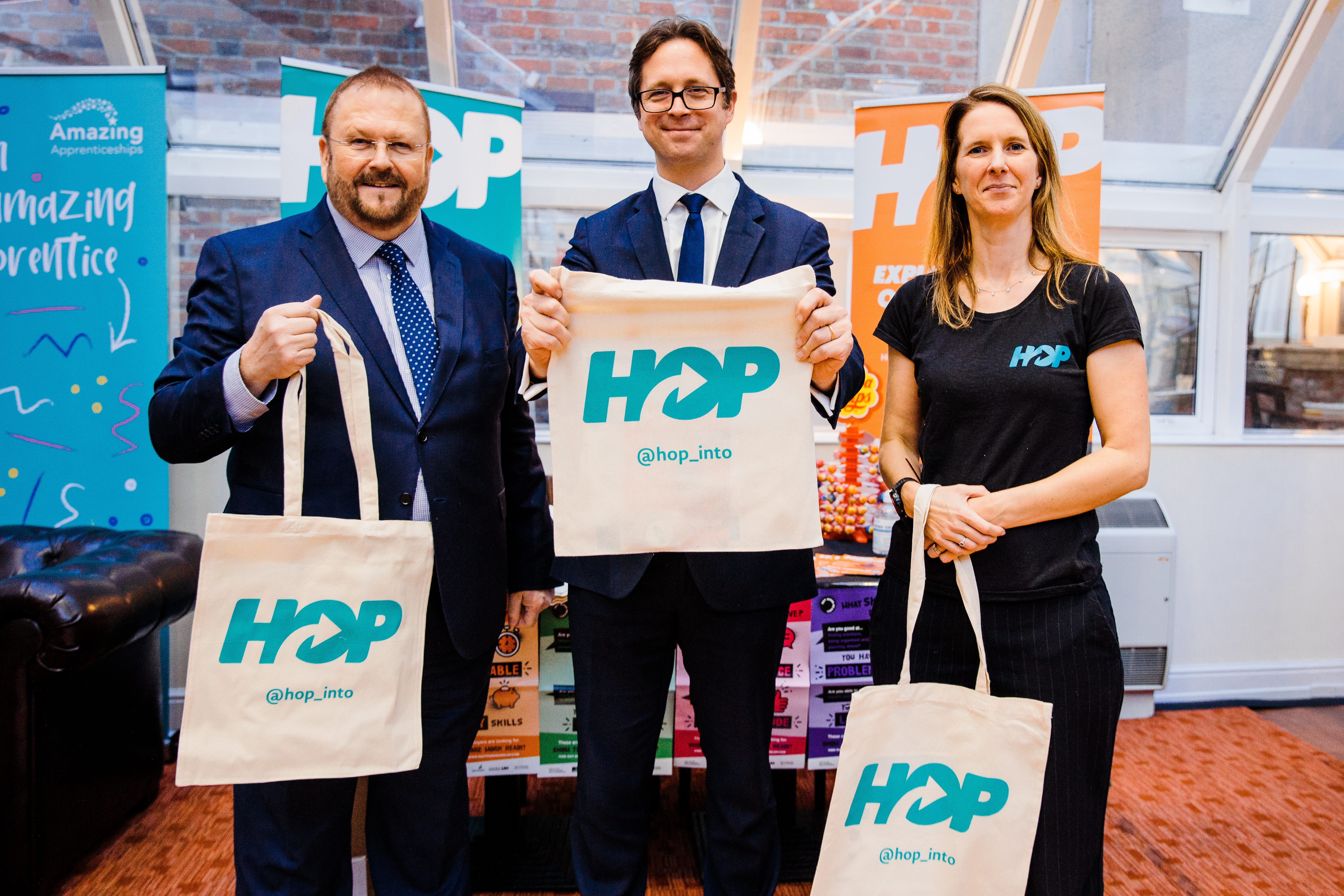 Adrian Hawkins, Minister for Skills Alex Burghart and Caroline Cartwright at the HOP stand