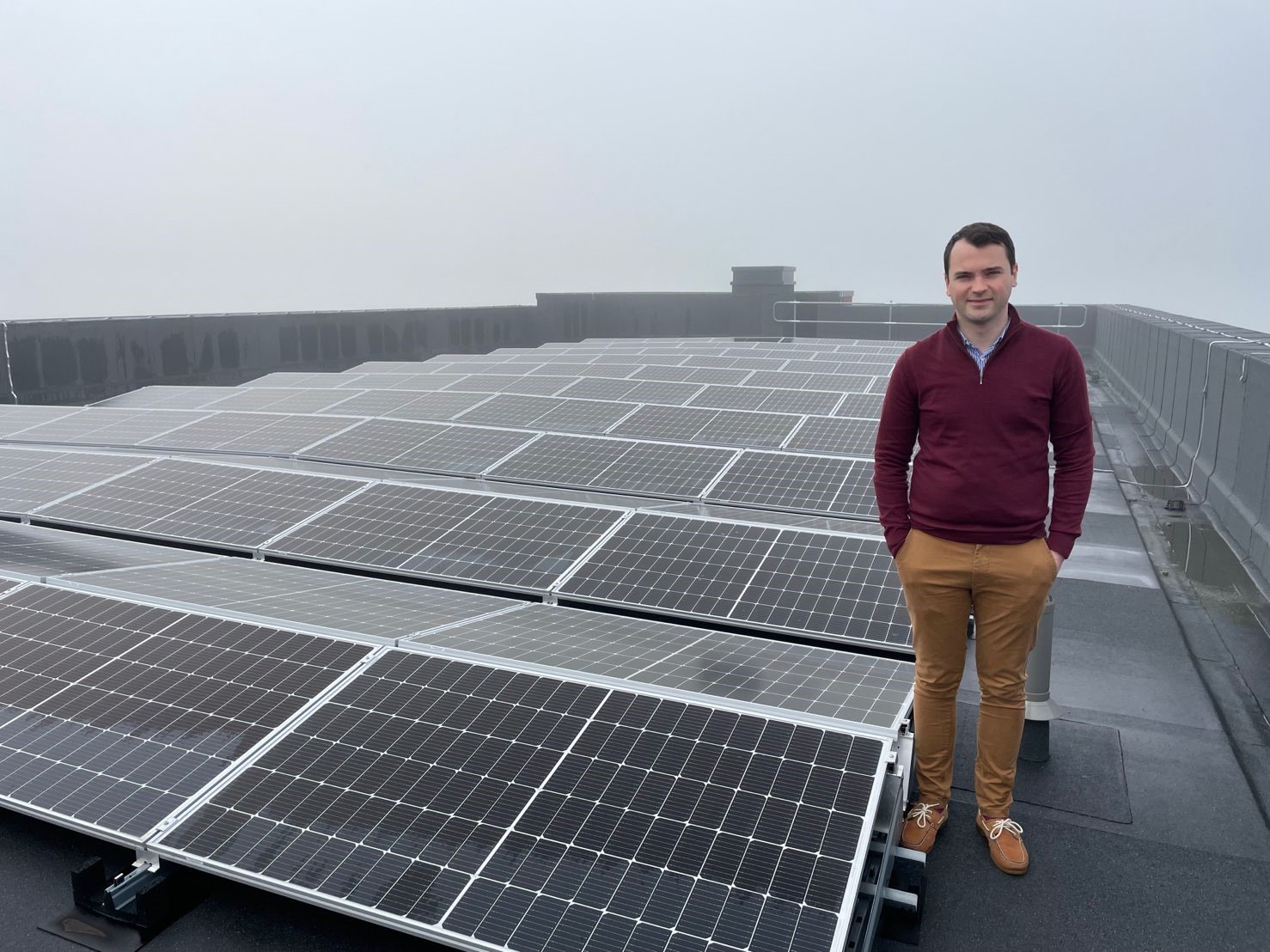 Cllr Lewis Cocking with solar panels at Theobalds Enterprise Centre 