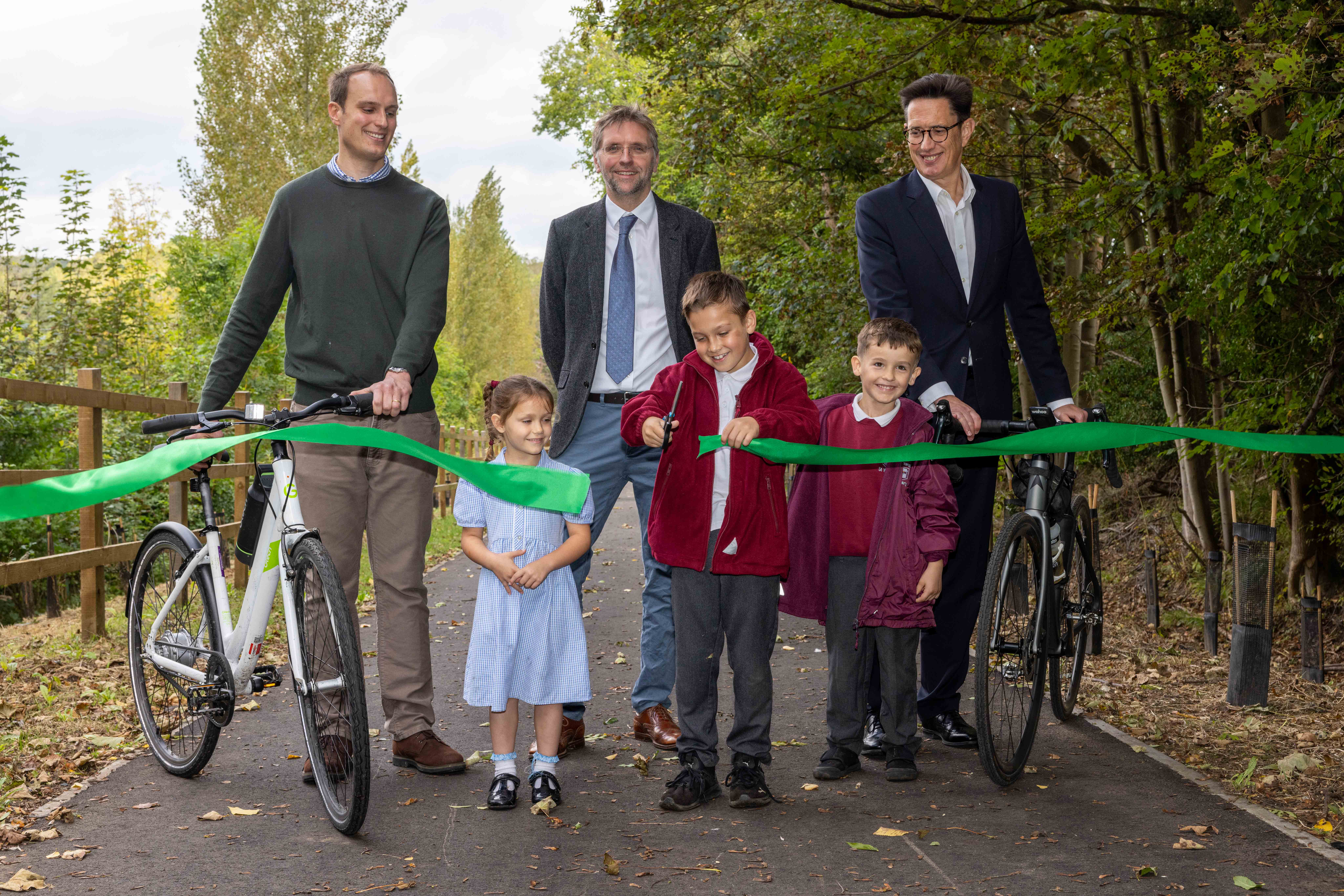 The new route is opened by: (back row, L to R) Thomas Abel-Smith - Woodhall Estate, Rupert Thacker - Hertfordshire County Council, Richard Whitehead - Hertfordshire LEP (front row) Alana Ricciardi, Maison Martins and Freddie Calvert, pupils from Tonwell St.Mary’s School