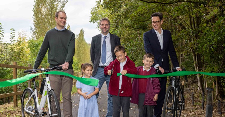 The new route is opened by: (back row, L to R) Thomas Abel-Smith - Woodhall Estate, Rupert Thacker - Hertfordshire County Council, Richard Whitehead - Hertfordshire LEP (front row) Alana Ricciardi, Maison Martins and Freddie Calvert, pupils from Tonwell St.Mary’s School